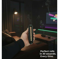 Hand holding DoinkRollerz rolling device with text 'Perfect rolls in 30 seconds. Every time.' in a dimly lit room.