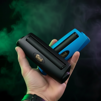 
              Hand holding two DoinkRollerz, one black and one blue, with a dark background.
            