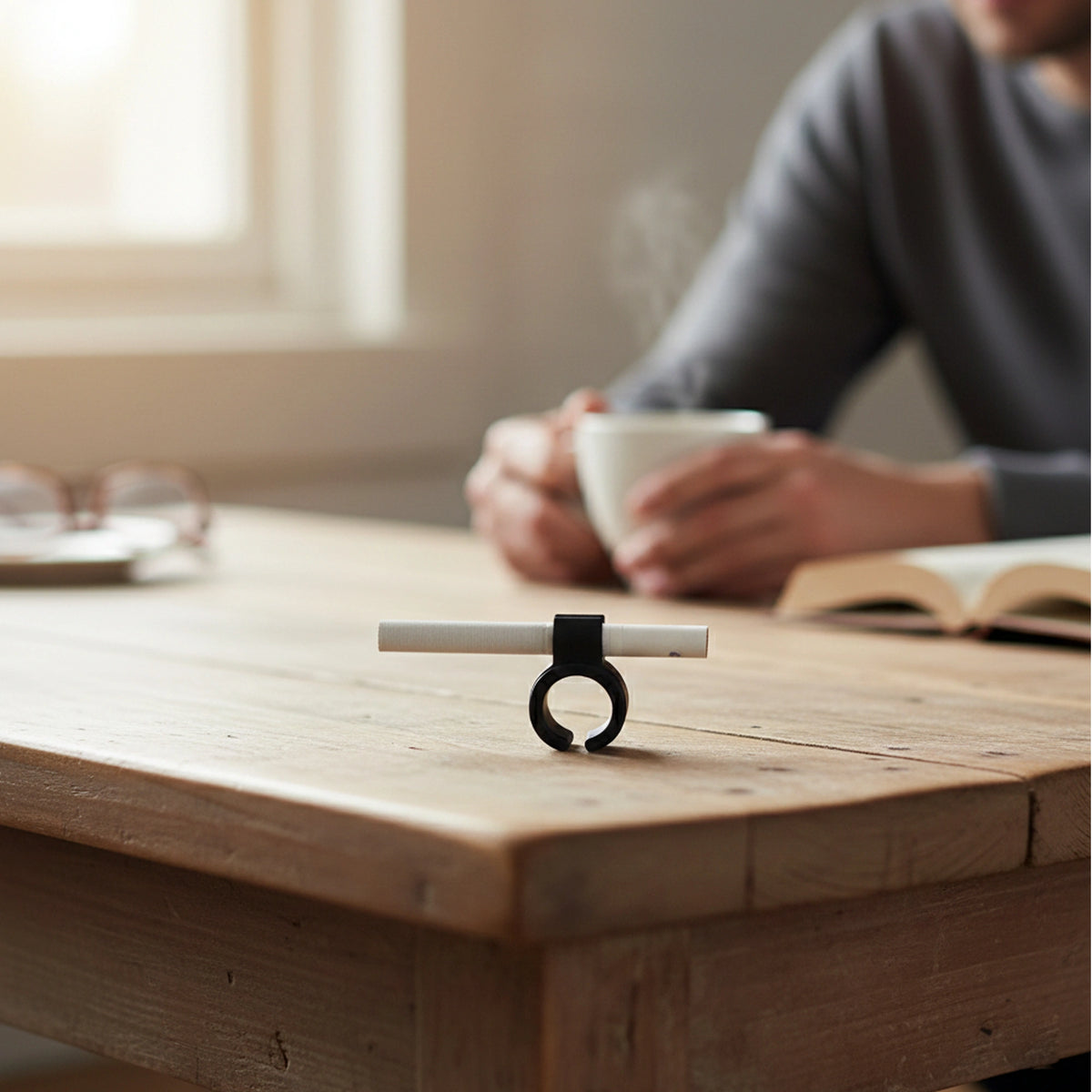 Flexible silicone smoke ring designed to hold a rolled joint hands-free