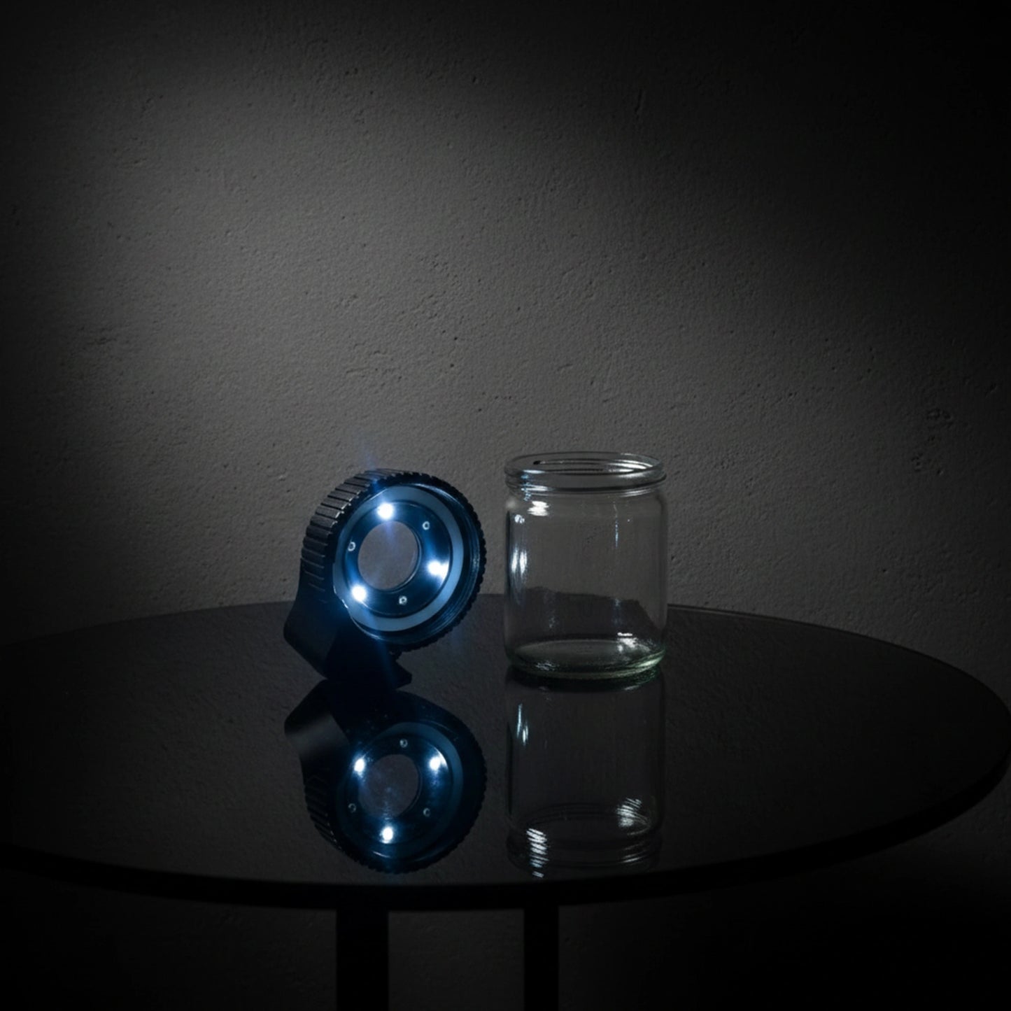 Compact glass storage jar featuring an integrated LED lighter