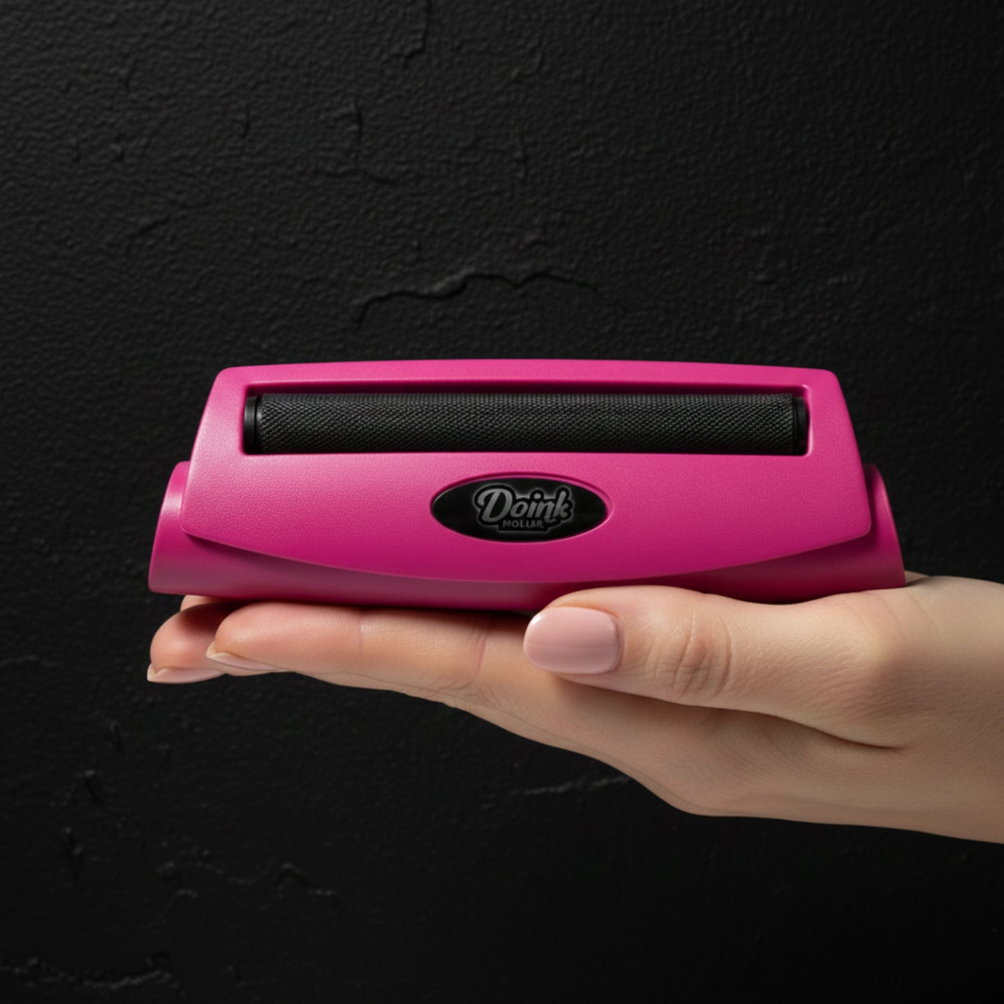 Pink DoinkRoller joint roller tool with matte pink finish