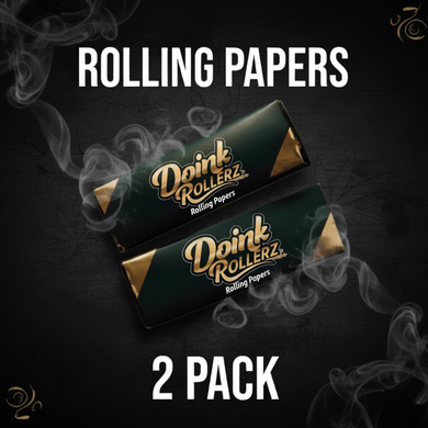 Two packs of Doink Rollerz rolling papers on a dark background with smoke effects.