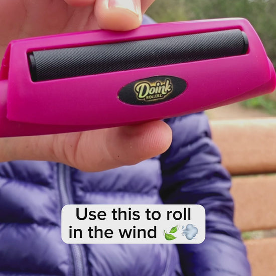 Pink DoinkRoller joint roller tool with matte pink finish